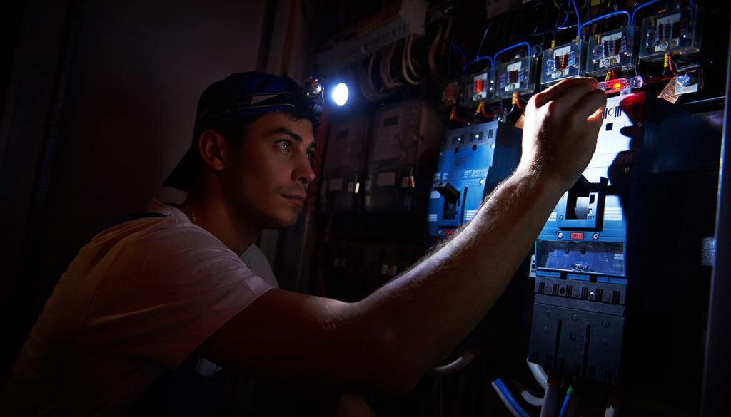 electrician working during damage